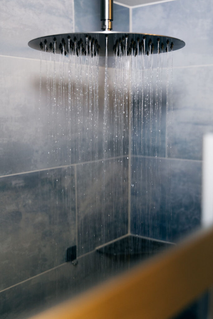 Shower pan installation in Auburn master bathroom remodel project